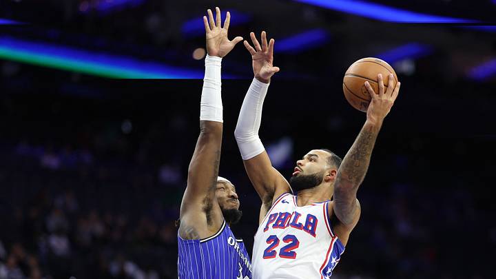Oct 10, 2025; Philadelphia, Pennsylvania, USA; Philadelphia 76ers forward Johni Broome (22) drives for a shot past Orlando Magic center/forward Wendell Carter Jr. (34) during the second quarter at Xfinity Mobile Arena. Mandatory Credit: Bill Streicher-Imagn Images