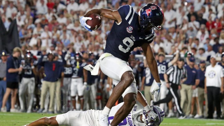Aug 31, 2024; Oxford, Mississippi, USA; Mississippi Rebels wide receiver Tre Harris (9) stiff arms Furman Paladins defensive back Jaylen Moson (8) as he crosses the goal-line during the first half at Vaught-Hemingway Stadium. Mandatory Credit: Petre Thomas-USA TODAY Sports Aug 31, 2024; Oxford, Mississippi, USA; Mississippi Rebels wide receiver Tre Harris (9) stiff arms Furman Paladins defensive back Jaylen Moson (8) as he crosses the goal-line during the first half at Vaught-Hemingway Stadium. Mandatory Credit: Petre Thomas-USA TODAY Sports