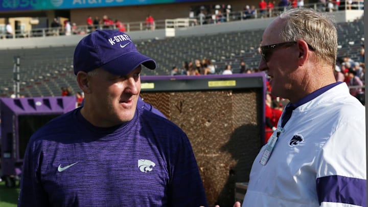 Oct 23, 2021; Lubbock, Texas, USA; Kansas State Wildcats Chris Klieman visits with Kansas State Director of Athletics Gene Taylor before the game against the Texas Tech Red Raiders at Jones AT&T Stadium. Mandatory Credit: Michael C. Johnson-Imagn Images Oct 23, 2021; Lubbock, Texas, USA; Kansas State Wildcats Chris Klieman visits with Kansas State Director of Athletics Gene Taylor before the game against the Texas Tech Red Raiders at Jones AT&T Stadium. Mandatory Credit: Michael C. Johnson-Imagn Images