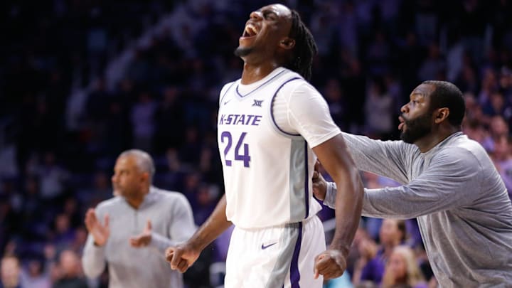 Kansas State junior transfer wing Arthur Kaluma (24) yells out after graduate transfer guard Tylor Perry hits a key shot.