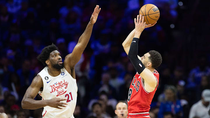 Mar 20, 2023; Philadelphia, Pennsylvania, USA; Chicago Bulls guard Zach LaVine (8) shoots the ball in front of Philadelphia 76ers center Joel Embiid (21) during the second quarter at Wells Fargo Center. Mandatory Credit: Bill Streicher-Imagn Images