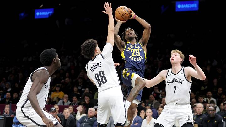 Feb 11, 2026; Brooklyn, New York, USA; Indiana Pacers guard Quenton Jackson (29) takes a shot against Brooklyn Nets guards Drake Powell (4) and Nolan Traore (88) and forward Danny Wolf (2) during the third quarter at Barclays Center. Mandatory Credit: Brad Penner-Imagn Images Feb 11, 2026; Brooklyn, New York, USA; Indiana Pacers guard Quenton Jackson (29) takes a shot against Brooklyn Nets guards Drake Powell (4) and Nolan Traore (88) and forward Danny Wolf (2) during the third quarter at Barclays Center. Mandatory Credit: Brad Penner-Imagn Images