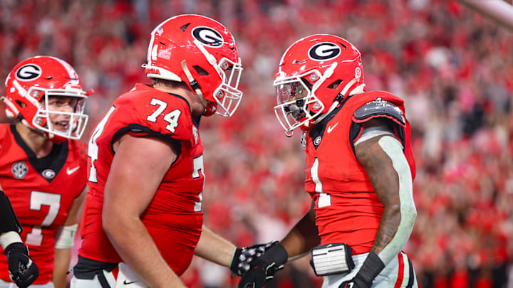 Oct 12, 2024; Athens, Georgia, USA; Georgia Bulldogs running back Trevor Etienne (1) celebrates after a touchdown with offensive lineman Drew Bobo (74) against the Mississippi State Bulldogs in the fourth quarter at Sanford Stadium. Mandatory Credit: Brett Davis-Imagn Images
