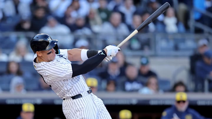 Mar 27, 2025; Bronx, New York, USA; New York Yankees right fielder Aaron Judge (99) follows through on an RBI double against the Milwaukee Brewers during the seventh inning at Yankee Stadium. Mar 27, 2025; Bronx, New York, USA; New York Yankees right fielder Aaron Judge (99) follows through on an RBI double against the Milwaukee Brewers during the seventh inning at Yankee Stadium.