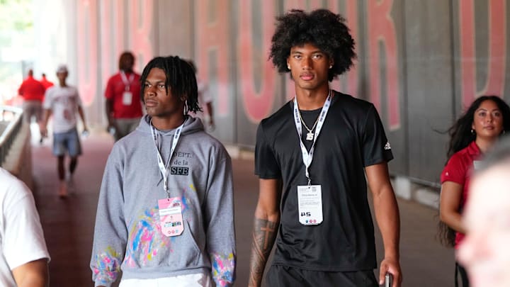 Aug 31, 2024; Columbus, OH, USA; Ohio State Buckeyes recruits Kayden Dixon-Wyatt and Chris Henry Jr. walk onto the field prior to the NCAA football game against the Akron Zips at Ohio Stadium. Ohio State won 52-6.