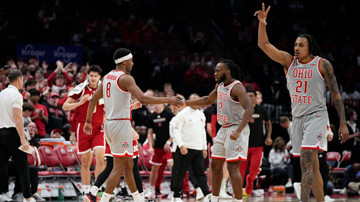 Ohio State Buckeyes guard Micah Parrish (8) celebrates a three pointer with guard Bruce Thornton (2) and forward Devin Royal (21) during the second half of the NCAA men's basketball game against the Nebraska Cornhuskers at Value City Arena in Columbus on March 4, 2025. Ohio State won 116-114.