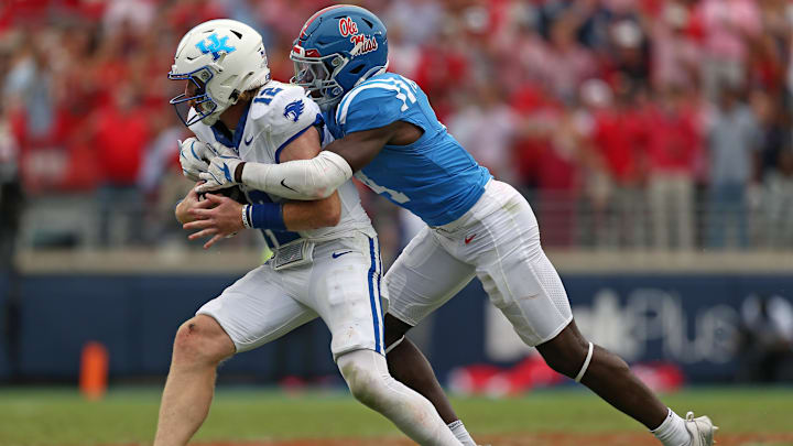 Sep 28, 2024; Oxford, Mississippi, USA; Mississippi Rebels linebacker Suntarine Perkins (4) sacks Kentucky Wildcats quarterback Brock Vandagriff (12) during the second half at Vaught-Hemingway Stadium. Mandatory Credit: Petre Thomas-Imagn Images Sep 28, 2024; Oxford, Mississippi, USA; Mississippi Rebels linebacker Suntarine Perkins (4) sacks Kentucky Wildcats quarterback Brock Vandagriff (12) during the second half at Vaught-Hemingway Stadium. Mandatory Credit: Petre Thomas-Imagn Images