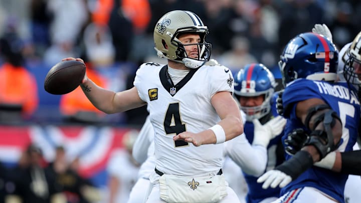 Dec 8, 2024; East Rutherford, New Jersey, USA; New Orleans Saints quarterback Derek Carr (4) drops back to pass against the New York Giants during the third quarter at MetLife Stadium.
