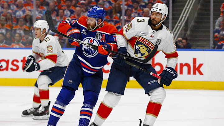 Florida Panthers defenseman Seth Jones defends against Edmonton Oilers center Leon Draisaitl.