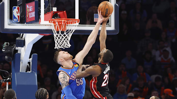 Feb 12, 2025; Oklahoma City, Oklahoma, USA; Oklahoma City Thunder center Isaiah Hartenstein (55) blocks a shot by Miami Heat forward Andrew Wiggins (22) during the second half at Paycom Center. Mandatory Credit: Alonzo Adams-Imagn Images