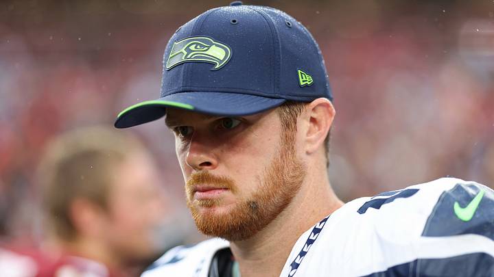 Seattle Seahawks quarterback Sam Darnold (14) stands on the field after the game against the Washington Commanders. Seattle Seahawks quarterback Sam Darnold (14) stands on the field after the game against the Washington Commanders.