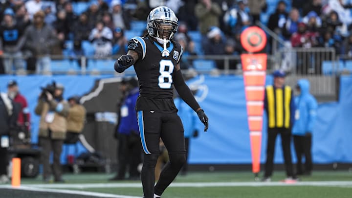 Dec 22, 2024; Charlotte, North Carolina, USA; Carolina Panthers cornerback Jaycee Horn (8) questions a call by the official  during the second half against the Arizona Cardinals at Bank of America Stadium. Mandatory Credit: Jim Dedmon-Imagn Images