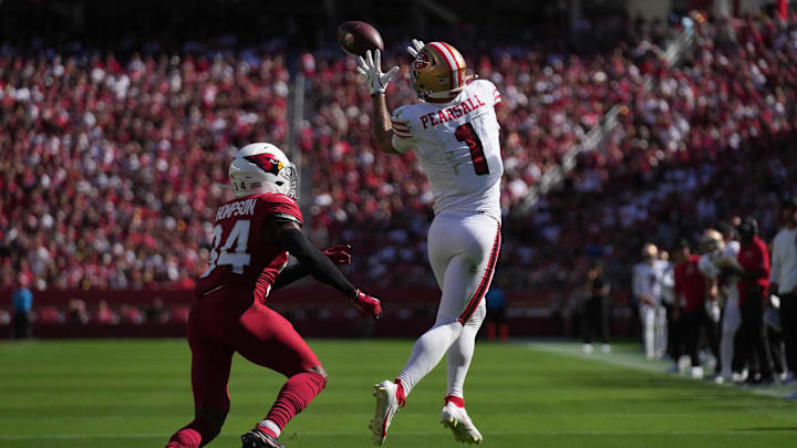 Sep 21, 2025; Santa Clara, California, USA; San Francisco 49ers wide receiver Ricky Pearsall (1) makes the catch inform of Arizona Cardinals safety Jalen Thompson (34) during the second half at Levi's Stadium. Mandatory Credit: Cary Edmondson-Imagn Images