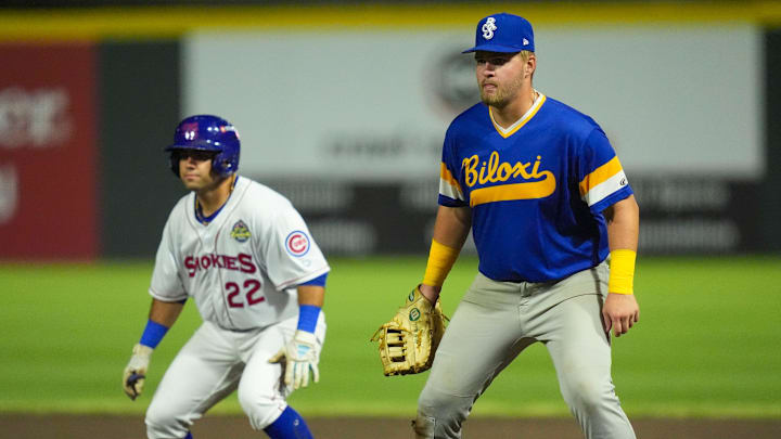 Biloxi Shuckers Blake Burke (38) covers first base as Knoxville Smokies' Reivaj Garcia (22) leads off base during a minor league baseball game on August 5, 2025, Knoxville, Tennessee.