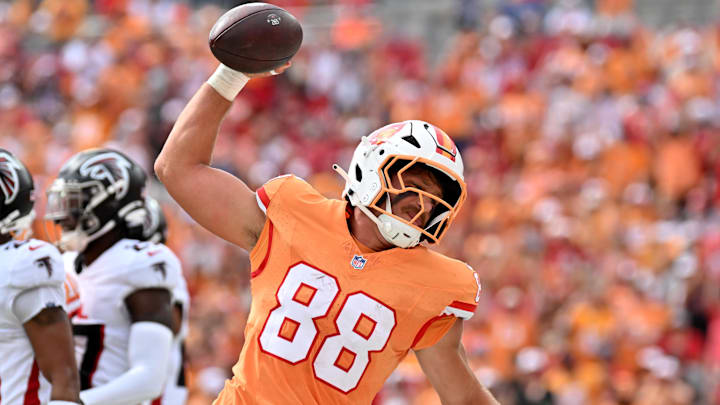Oct 27, 2024; Tampa, Florida, USA; Tampa Bay Buccaneers tight end Cade Otton (88) spikes the ball after scoring a touchdown in the first half  against the Atlanta Falcons at Raymond James Stadium. 