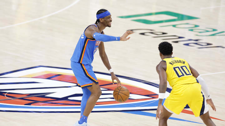 Jun 22, 2025; Oklahoma City, Oklahoma, USA; Oklahoma City Thunder guard Shai Gilgeous-Alexander (2) dribbles the ball against Indiana Pacers guard Bennedict Mathurin (00) during the second half of game seven of the 2025 NBA Finals at Paycom Center. Mandatory Credit: Alonzo Adams-Imagn Images