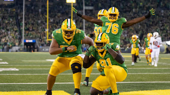 Players celebrate a touchdown by Oregon offensive lineman Gernorris Wilson as the Oregon Ducks host the Maryland Terrapins at Autzen Stadium Saturday, Nov. 9, 2024 in Eugene, Ore.