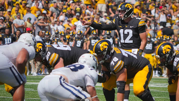 Iowa Hawkeyes quarterback Cade McNamara (12) leads the offense as the Hawkeyes take on Utah State at Kinnick Stadium in Iowa City, Saturday, Sept. 2, 2023.