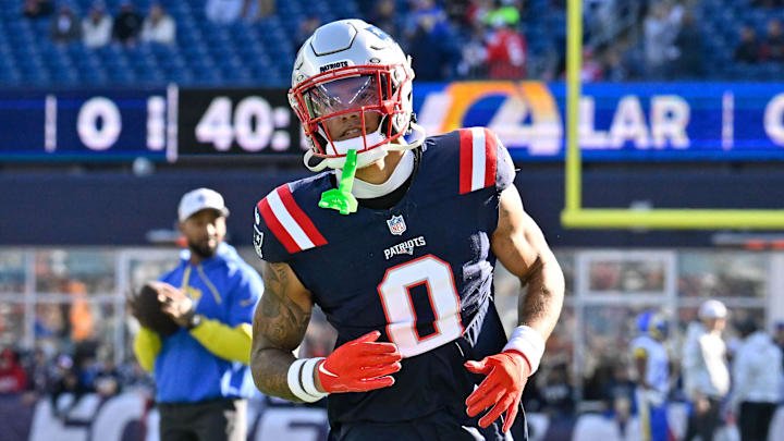 Nov 17, 2024; Foxborough, Massachusetts, USA;  New England Patriots cornerback Christian Gonzalez (0) warms up before a game against the Los Angeles Rams at Gillette Stadium. Mandatory Credit: Eric Canha-Imagn Images