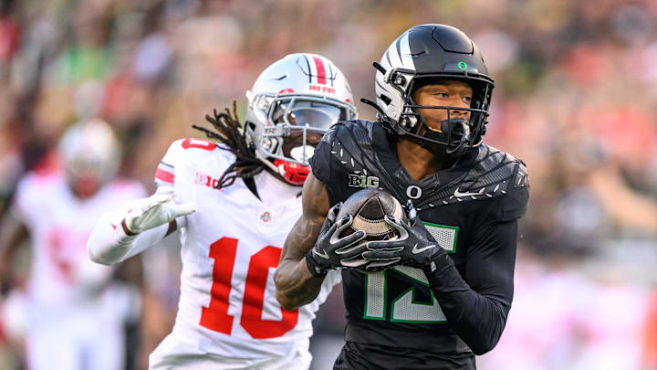 Oct 12, 2024; Eugene, Oregon, USA; Oregon Ducks wide receiver Tez Johnson (15) makes a catch for a touchdown during the second quarter against the Ohio State Buckeyes at Autzen Stadium. 