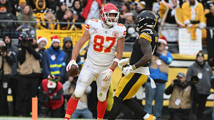 Dec 25, 2024; Pittsburgh, Pennsylvania, USA; Kansas City Chiefs tight end Travis Kelce (87) celebrates a touchdown in front of Pittsburgh Steelers linebacker Patrick Queen (6) during the second half at Acrisure Stadium. Mandatory Credit: Barry Reeger-Imagn Images