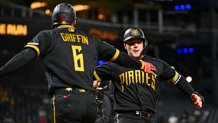 May 1, 2026; Pittsburgh, Pennsylvania, USA; Pittsburgh Pirates catcher Henry Davis (32) celebrates with shortstop Konnor Griffin (6) as he crosses home plate after hitting a two run home run against the Cincinnati Reds during the fifth inning at PNC Park. Mandatory Credit: Justin Berl-Imagn Images