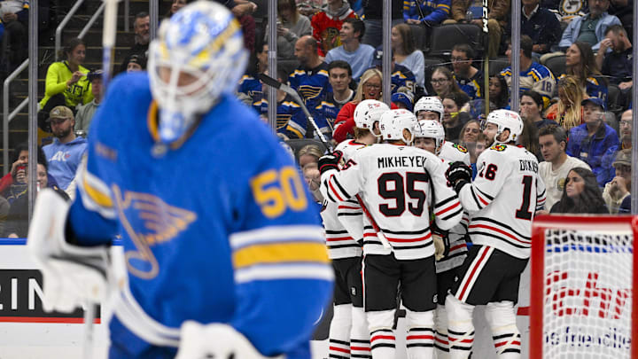 Oct 15, 2025; St. Louis, Missouri, USA; Chicago Blackhawks center Jason Dickinson (16) is congratulated by teammates after scoring against St. Louis Blues goaltender Jordan Binnington (50) during the second period at Enterprise Center. Mandatory Credit: Jeff Curry-Imagn Images