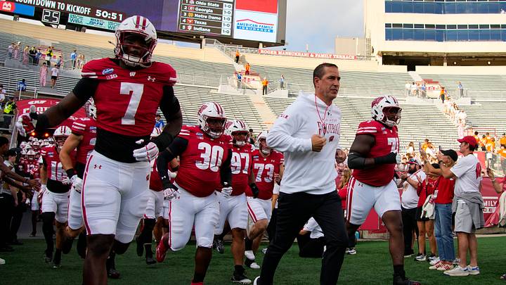 Sep 12, 2026; Madison, Wisconsin, USA;  Wisconsin Badgers head coach Luke Fickell leads the team onto the field for warmups prior to the game against the Western Illinois Leathernecks at Camp Randall Stadium. Mandatory Credit: Jeff Hanisch-Imagn Images