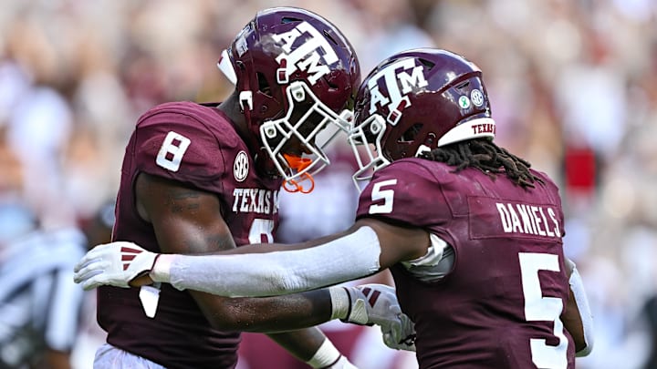 Oct 5, 2024; College Station, Texas, USA; Texas A&M Aggies running back Le'Veon Moss (8) celebrates after scoring a touchdown with running back Amari Daniels (5) in the fourth quarter against the Missouri Tigers at Kyle Field. Mandatory Credit: Maria Lysaker-Imagn Images. Oct 5, 2024; College Station, Texas, USA; Texas A&M Aggies running back Le'Veon Moss (8) celebrates after scoring a touchdown with running back Amari Daniels (5) in the fourth quarter against the Missouri Tigers at Kyle Field. Mandatory Credit: Maria Lysaker-Imagn Images.