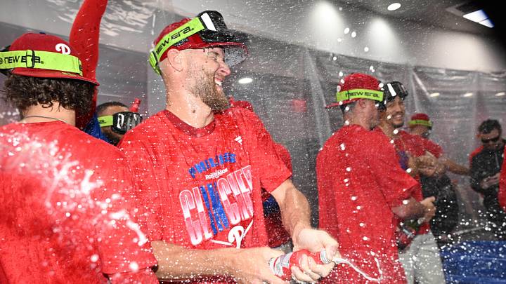 Sep 27, 2026; Philadelphia, Pennsylvania, USA; Philadelphia Phillies pitcher Zack Wheeler (45) celebrates in the locker room after win against the Tampa Bay Rays and clinching a playoff spot at Citizens Bank Park. Mandatory Credit: Eric Hartline-Imagn Images