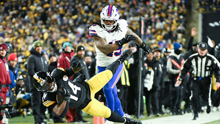 Nov 30, 2025; Pittsburgh, Pennsylvania, USA; Pittsburgh Steelers running back Kenneth Gainwell (14) is tackled out of bounds by Buffalo Bills linebacker Shaq Thompson (45) during the second quarter at Acrisure Stadium.