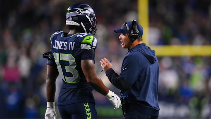Oct 20, 2025; Seattle, Washington, USA; Seattle Seahawks linebacker Ernest Jones IV (13) talks with Seattle Seahawks head coach Mike Macdonald during the fourth quarter against the Houston Texans at Lumen Field.