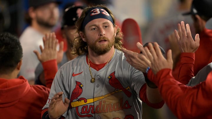 May 13, 2024; Anaheim, California, USA;   St. St. Louis Cardinals left fielder Brendan Donovan (33) is greeted in the dugout after scoring a run in the seventh inning against the Los Angeles Angels at Angel Stadium. Mandatory Credit: Jayne Kamin-Oncea-Imagn Images