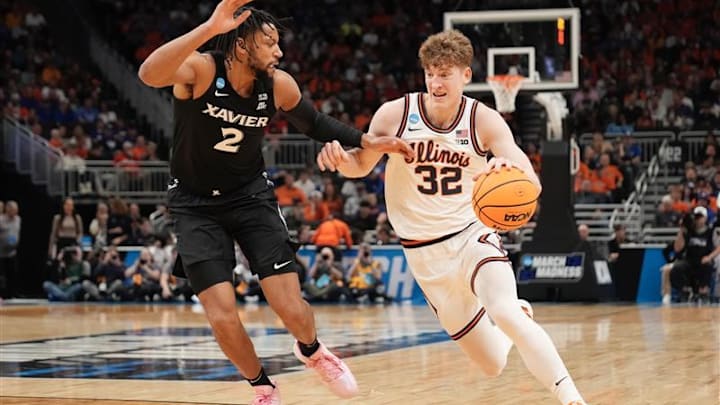 Illinois guard Kasparas Jakucionis (32) drives to the basket against Xavier forward Jerome Hunter (2) in an NCAA Tournament game at Fiserv Forum in Milwaukee, Wisconsin on Friday, March 21, 2025.