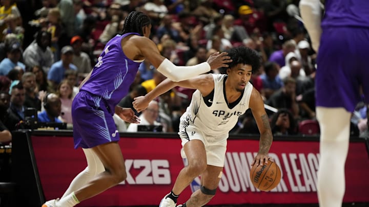 Jul 14, 2025; Las Vegas, NV, USA; San Antonio Spurs guard Dylan Harper dribbles the ball against Utah Jazz forward Cody Williams (5) during the second half of a NBA basketball game at the Thomas & Mack Center. Mandatory Credit: Lucas Peltier-Imagn Images Jul 14, 2025; Las Vegas, NV, USA; San Antonio Spurs guard Dylan Harper dribbles the ball against Utah Jazz forward Cody Williams (5) during the second half of a NBA basketball game at the Thomas & Mack Center. Mandatory Credit: Lucas Peltier-Imagn Images
