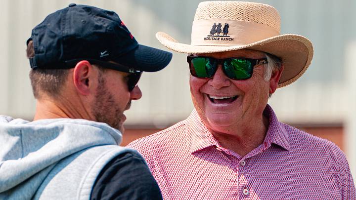 Arkansas Razorbacks coach Ryan Silverfield speaks with form coach Houston Nutt at a recent practice.