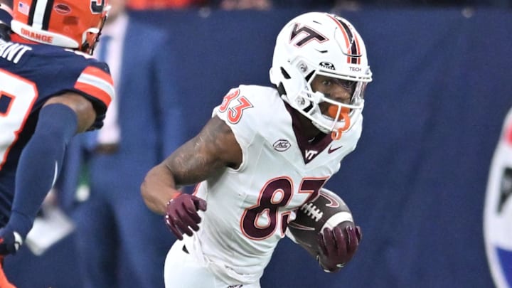 Nov 2, 2024; Syracuse, New York, USA; Virginia Tech Hokies wide receiver Jaylin Lane (83) runs up field after making a catch against the Syracuse Orange in the first quarter at JMA Wireless Dome. Mandatory Credit: Mark Konezny-Imagn Images