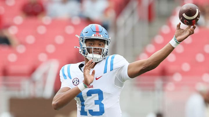 Nov 2, 2024; Fayetteville, Arkansas, USA; Ole Miss Rebels quarterback Austin Simmons (13) during the fourth quarter against the Arkansas Razorbacks at Donald W. Reynolds Razorback Stadium. Mississippi won 63-31. Mandatory Credit: Nelson Chenault-Imagn Images