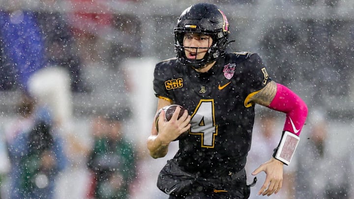 Dec 16, 2023; Orlando, FL, USA;  Appalachian State Mountaineers quarterback Joey Aguilar (4) runs with the ball against the Miami (OH) Redhawks in the second quarter during the Avocados from Mexico Cure Bowl at FBC Mortgage Stadium. Mandatory Credit: Nathan Ray Seebeck-Imagn Images