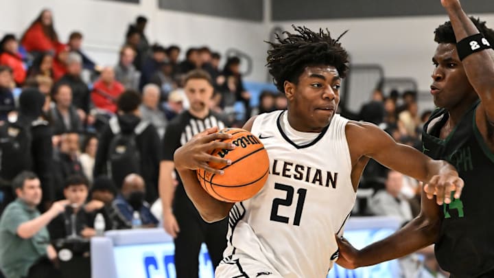 Salesian's Carlton Perrilliat (21), shown here in a game last season vs. St. Joseph-Santa Maria, scored eight straight key points in the second quarter to help the Pride upend De La Salle Wednesday in North Coast Section Open Division semifinal action at Albany High School. 