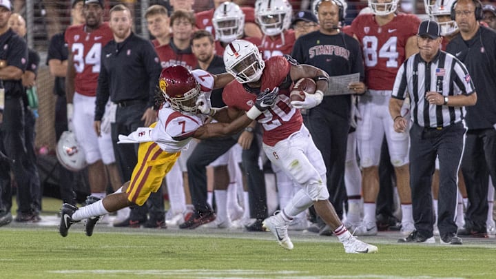 Sep 8, 2018; Stanford, CA, USA; Stanford Cardinal running back Bryce Love (20) is tackled by USC Trojans safety Marvell Tell III (7) during the fourth quarter at Stanford Stadium. Mandatory Credit: Neville E. Guard-Imagn Images Sep 8, 2018; Stanford, CA, USA; Stanford Cardinal running back Bryce Love (20) is tackled by USC Trojans safety Marvell Tell III (7) during the fourth quarter at Stanford Stadium. Mandatory Credit: Neville E. Guard-Imagn Images