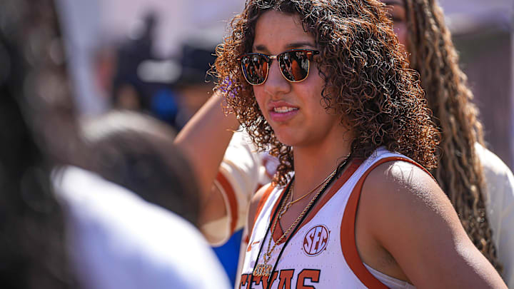 Basketball recruit Aaliyah Chavez walks the sideline ahead of the Texas Longhorns game against Mississippi State at Darrell K Royal-Texas Memorial Stadium in Austin Saturday, Sept. 28, 2024.