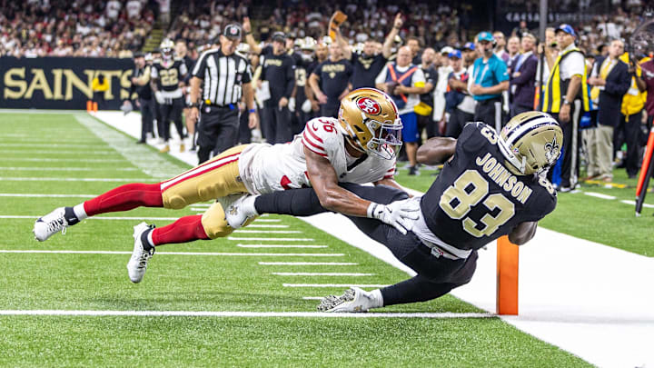 Sep 14, 2025; New Orleans, Louisiana, USA; New Orleans Saints tight end Juwan Johnson (83) catches a touchdown against San Francisco 49ers safety Marques Sigle (36) during the first half at Caesars Superdome. Mandatory Credit: Stephen Lew-Imagn Images Sep 14, 2025; New Orleans, Louisiana, USA; New Orleans Saints tight end Juwan Johnson (83) catches a touchdown against San Francisco 49ers safety Marques Sigle (36) during the first half at Caesars Superdome. Mandatory Credit: Stephen Lew-Imagn Images