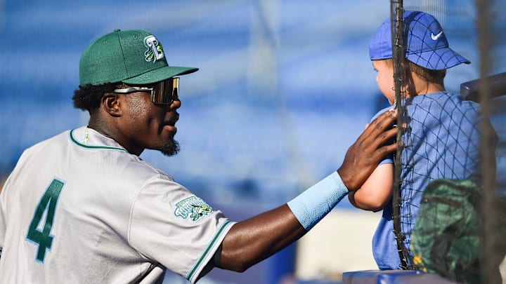 Daytona Tortugas' Jay Allen (4) says hello to fan James Russo, 5, of Port St. Lucie, before a game against the St. Lucie Mets on Tuesday, April 26, 2022, at Clover Park in Port St. Lucie. Allen is a former John Carroll Catholic star. The Daytona Tortugas is a minor league team for the Cincinnati Reds.

Tcn Jay Allen Homecoming 2