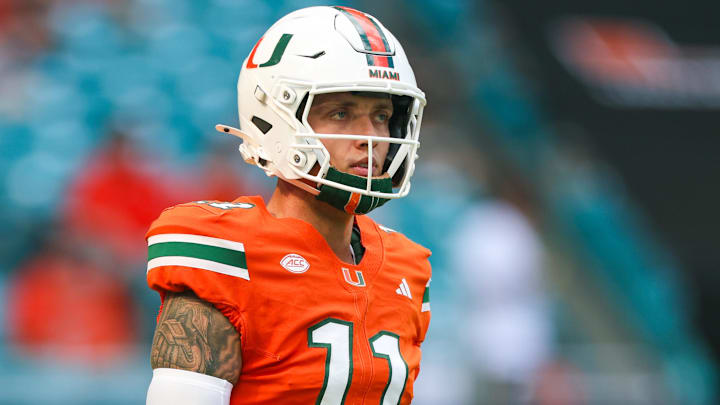 Miami Hurricanes quarterback Carson Beck (11) warms up before a game against the South Florida Bulls at Hard Rock Stadium. Miami Hurricanes quarterback Carson Beck (11) warms up before a game against the South Florida Bulls at Hard Rock Stadium.