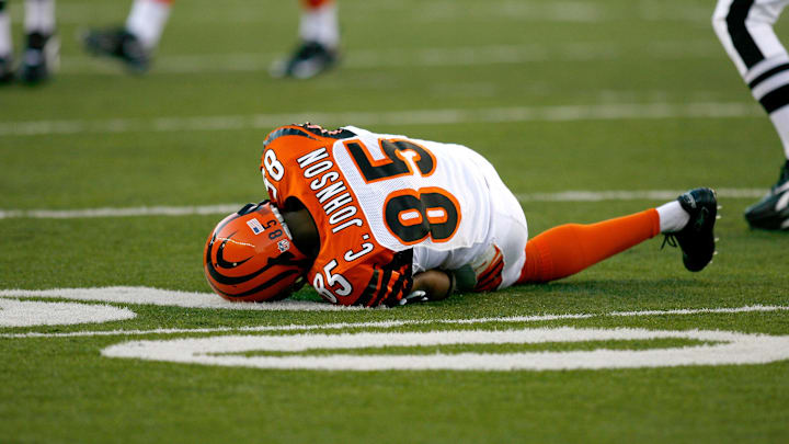 Aug 17, 2008; Cincinnati, OH, USA; Cincinnati Bengal receiver Chad Johnson (85) lays on the field after being hit by the Detroit Lions cornerback Brian Kelly (not pictured) in the first quarter at Paul Brown Stadium in Cincinnati, OH. Johnson was taken out of the game with an injured shoulder. Mandatory Credit: Frank Victores-Imagn Images