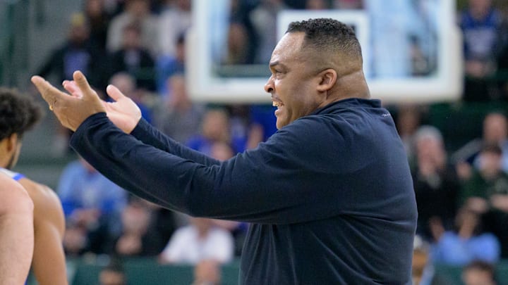 Jan 21, 2024; New Orleans, Louisiana, USA; Tulane Green Wave head coach Ron Hunter pumps up the crowd during the first half against the Memphis Tigers at Avron B. Fogelman Arena in Devlin Fieldhouse. Mandatory Credit: Matthew Hinton-Imagn Images Jan 21, 2024; New Orleans, Louisiana, USA; Tulane Green Wave head coach Ron Hunter pumps up the crowd during the first half against the Memphis Tigers at Avron B. Fogelman Arena in Devlin Fieldhouse. Mandatory Credit: Matthew Hinton-Imagn Images