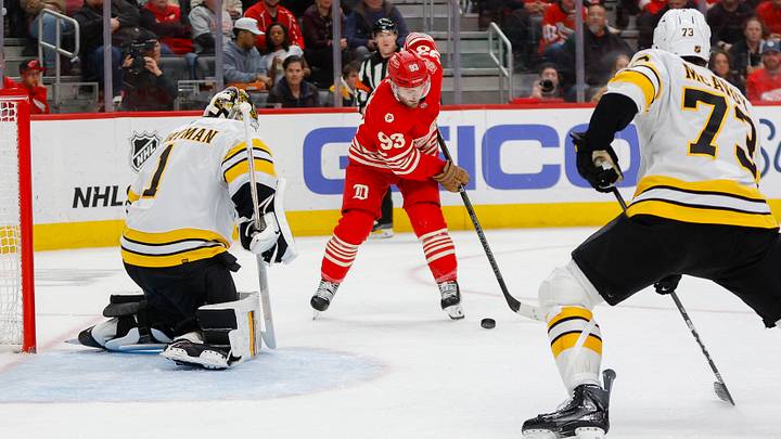 Mar 21, 2026; Detroit, Michigan, USA; Detroit Red Wings right wing Alex DeBrincat (93) takes a shot on Boston Bruins goaltender Jeremy Swayman (1) during the second period at Little Caesars Arena. Mandatory Credit: Brian Bradshaw Sevald-Imagn Images
