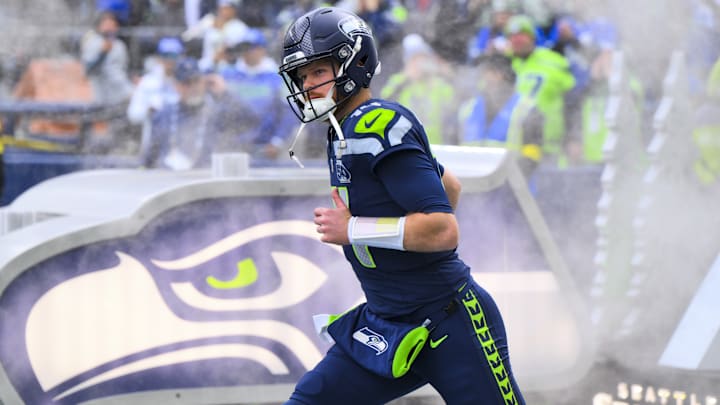 Dec 14, 2025; Seattle, Washington, USA; Seattle Seahawks quarterback Sam Darnold (14) exits the tunnel during player introductions before a game against the Los Angeles Chargers at Lumen Field. 