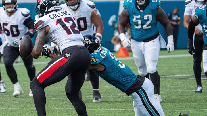 Jacksonville Jaguars cornerback Tyson Campbell (3) strips the ball from Houston Texans wide receiver Nico Collins (12) during the fourth quarter between the Houston Texans and the Jacksonville Jaguars Sunday September 21, 2025 at EverBank Stadium in Jacksonville, Fla. The Jaguars defeated the Texans 17-10. [Doug Engle/Florida Times-Union]